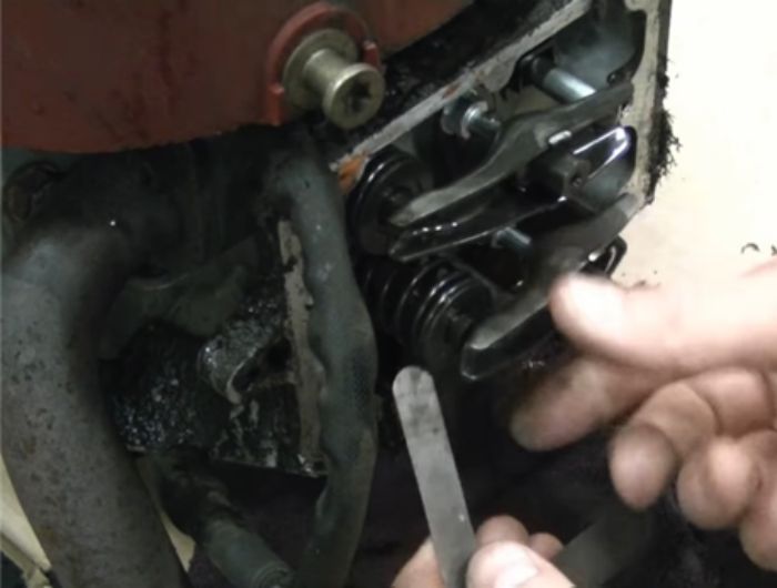 Remove the Spark plug & Check the Existing Gap between the Valves 4